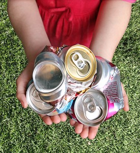 Cans Collector holding cans for recycling